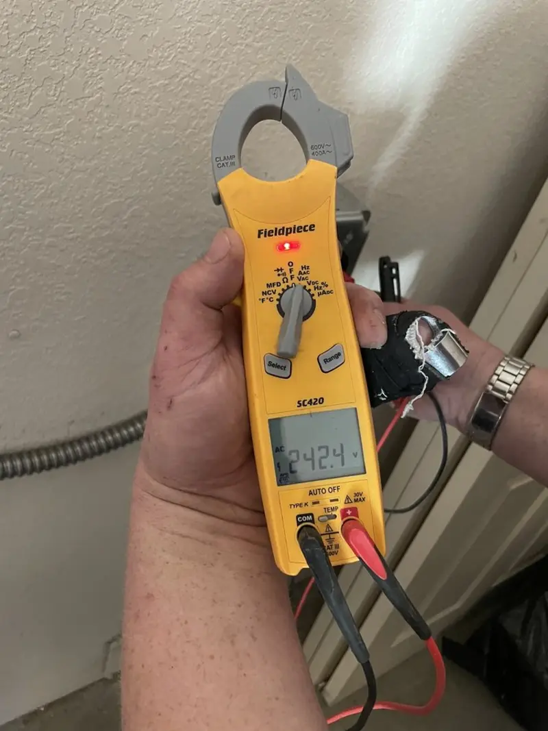 Voltage testing with clamp meter during Outlet Installation in Sanford